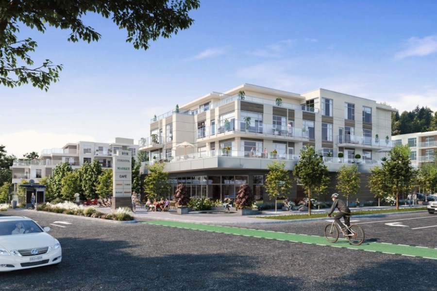 The exterior of Cordova Bay Shopping Center, a commercial property, designed by Alan Lowe Architecture with commercial spaces on the first level, and residential properties on the top three levels.