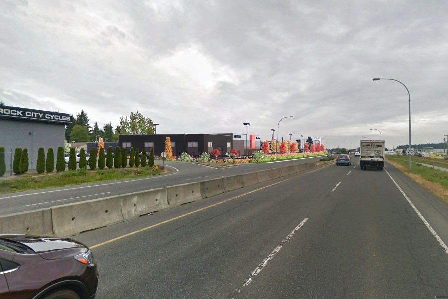 A exterior rendering of the Nissan Dealership in Nanaimo, a commercial project, designed by Alan Lowe Architecture.